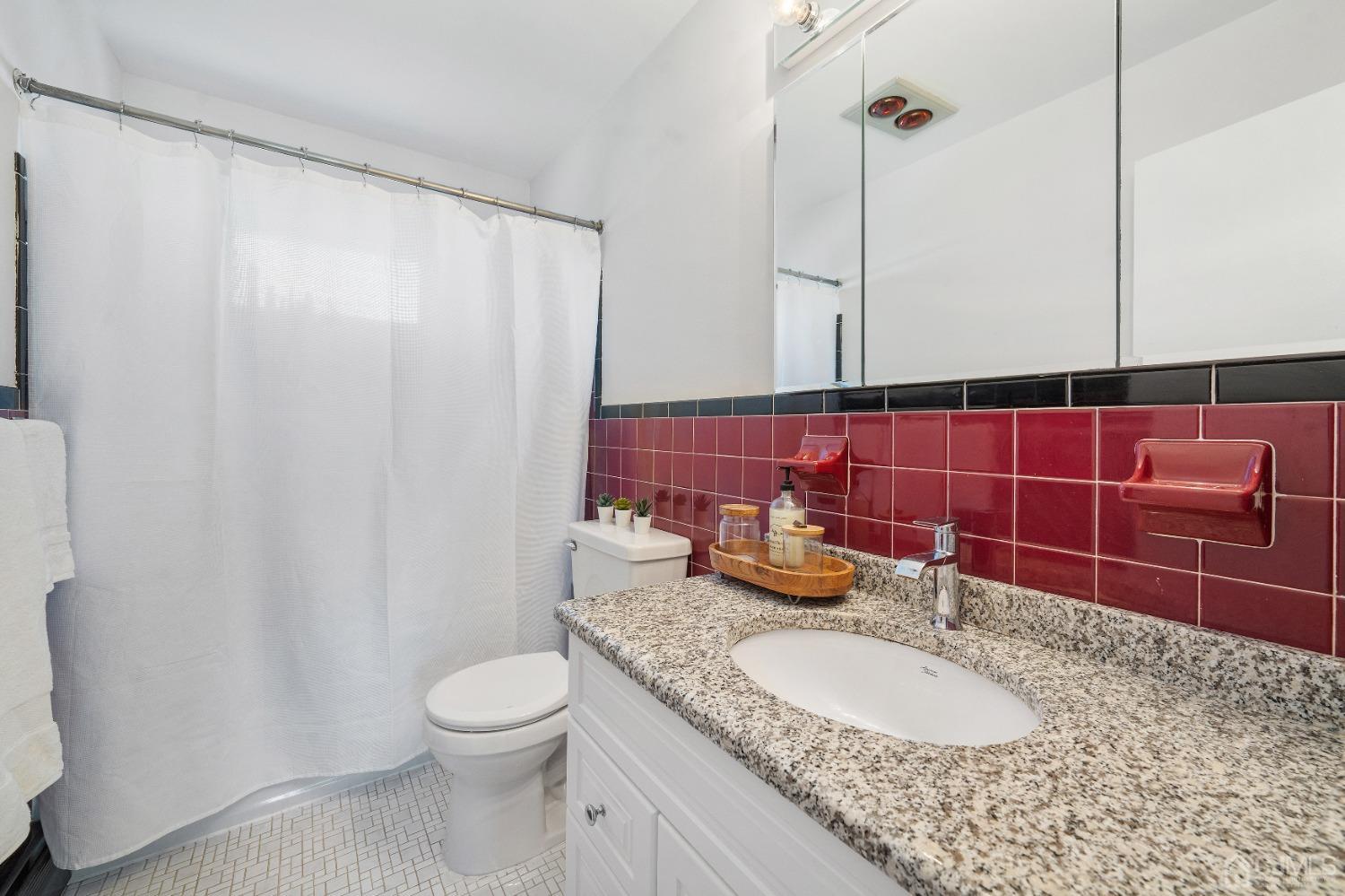 22 Baldwin Road Edison, NJ 08817 - Photo 15 of 30 a bathroom with a granite countertop sink toilet and mirror