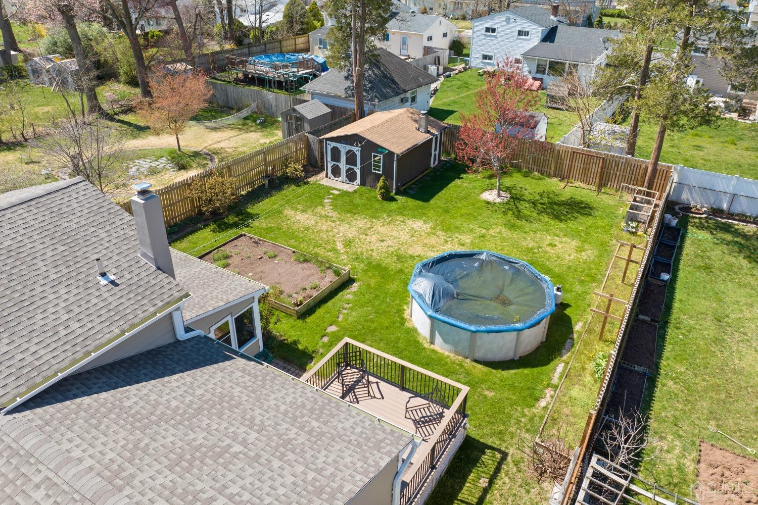 22 Baldwin Road Edison, NJ 08817 - Photo 21 of 30 swimming pool view with a seating space and garden view