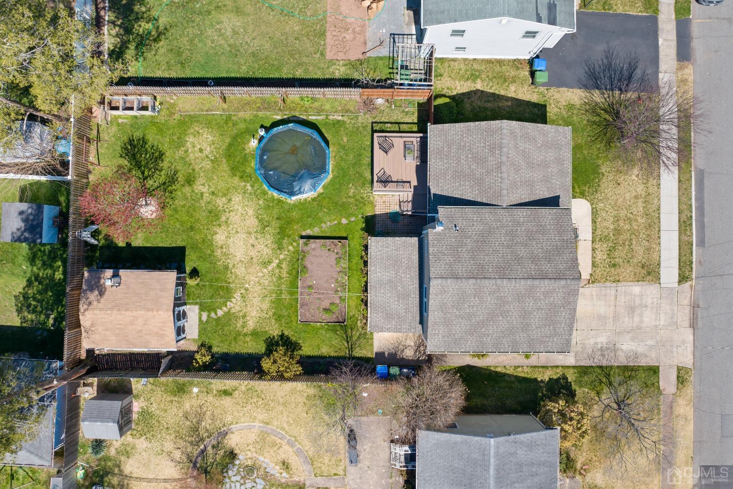 22 Baldwin Road Edison, NJ 08817 - Photo 22 of 30 an aerial view of a house with a garden and pool