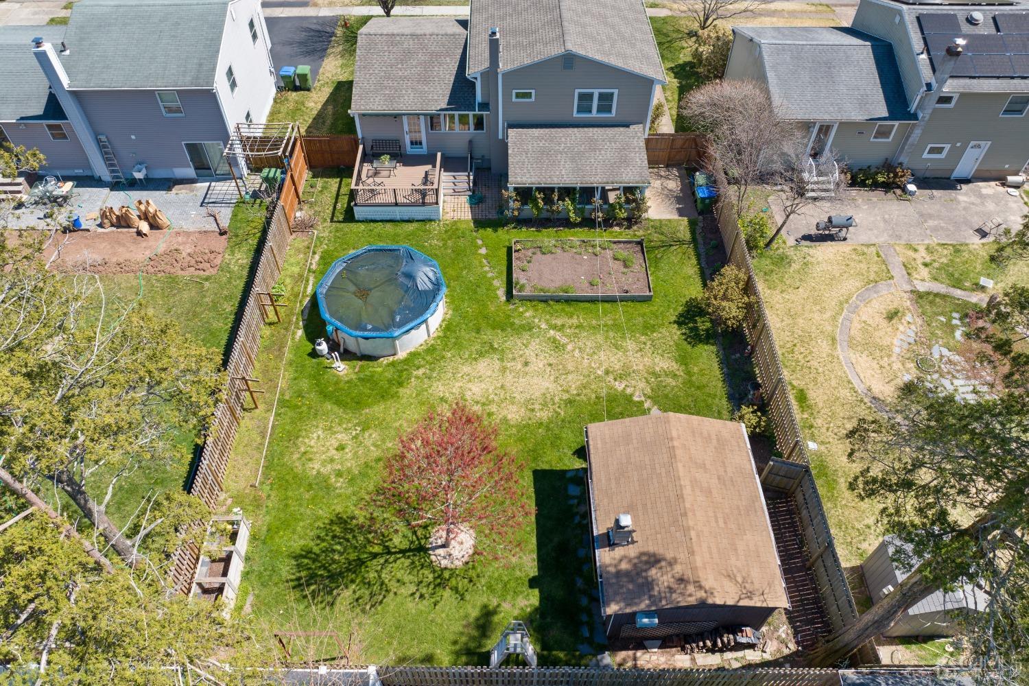 22 Baldwin Road Edison, NJ 08817 - Photo 23 of 30 an aerial view of a house with a swimming pool