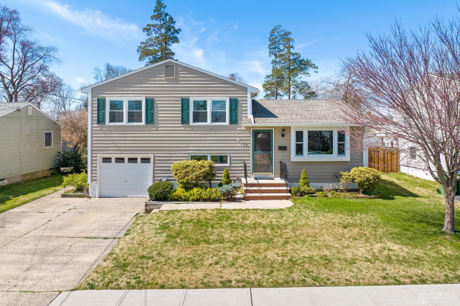 22 Baldwin Road Edison, NJ 08817 - Photo 24 of 30 a front view of a house with a yard