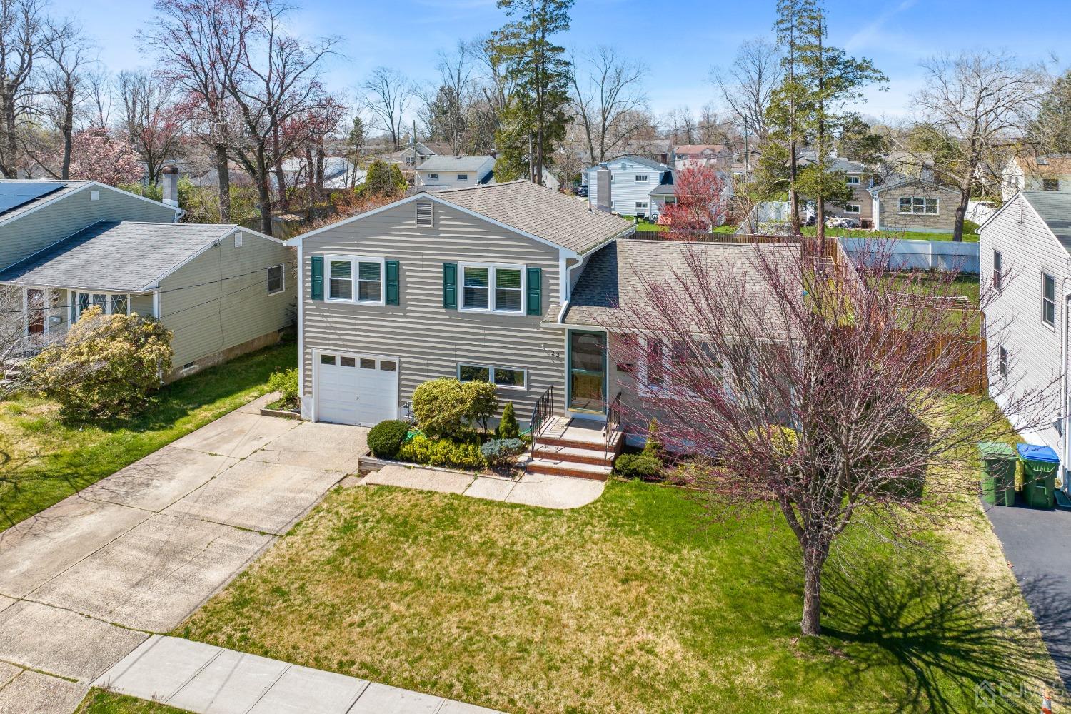22 Baldwin Road Edison, NJ 08817 - Photo 25 of 30 a front view of a house with a yard