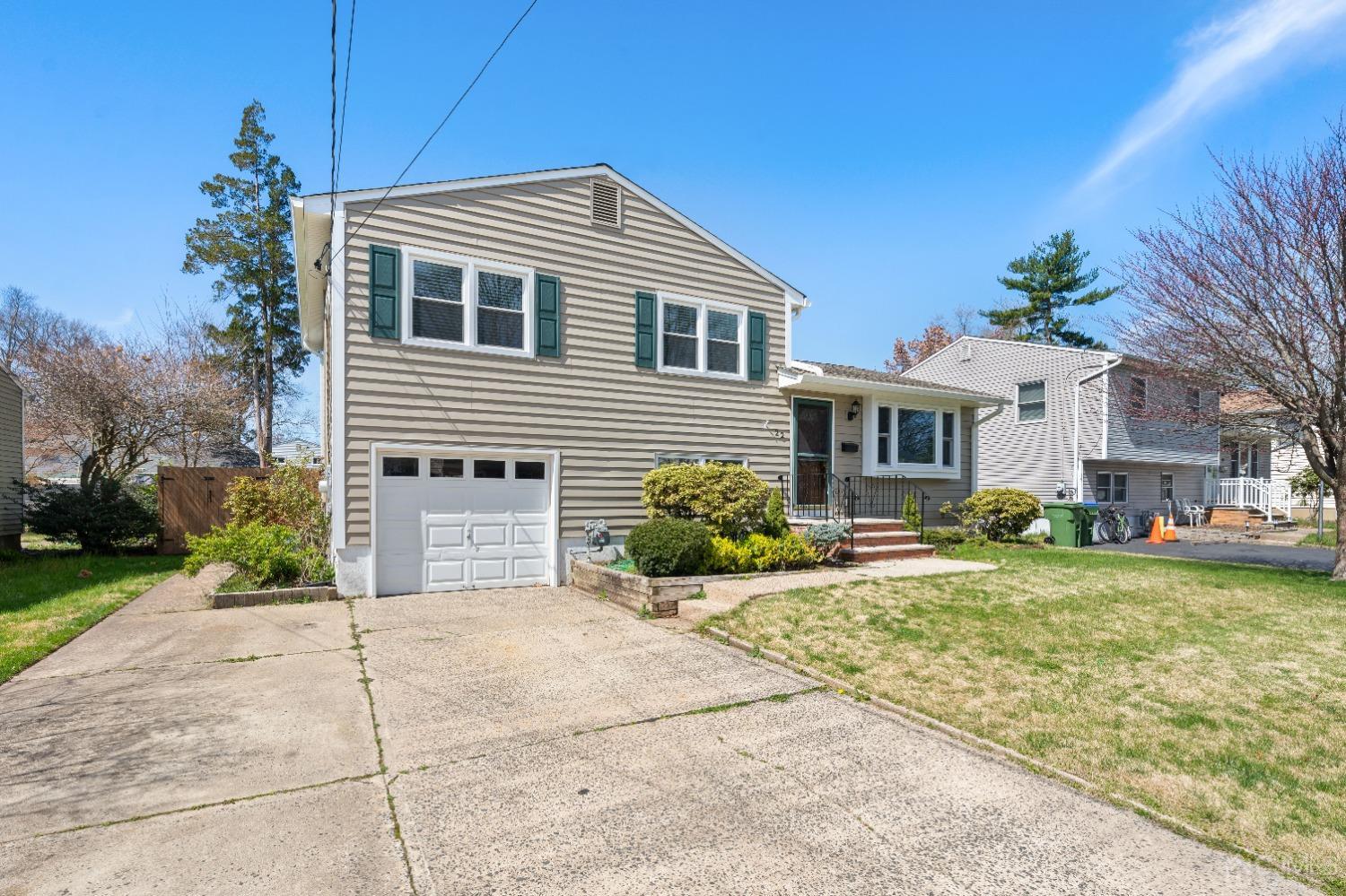 22 Baldwin Road Edison, NJ 08817 - Photo 28 of 30 a front view of a house with a yard