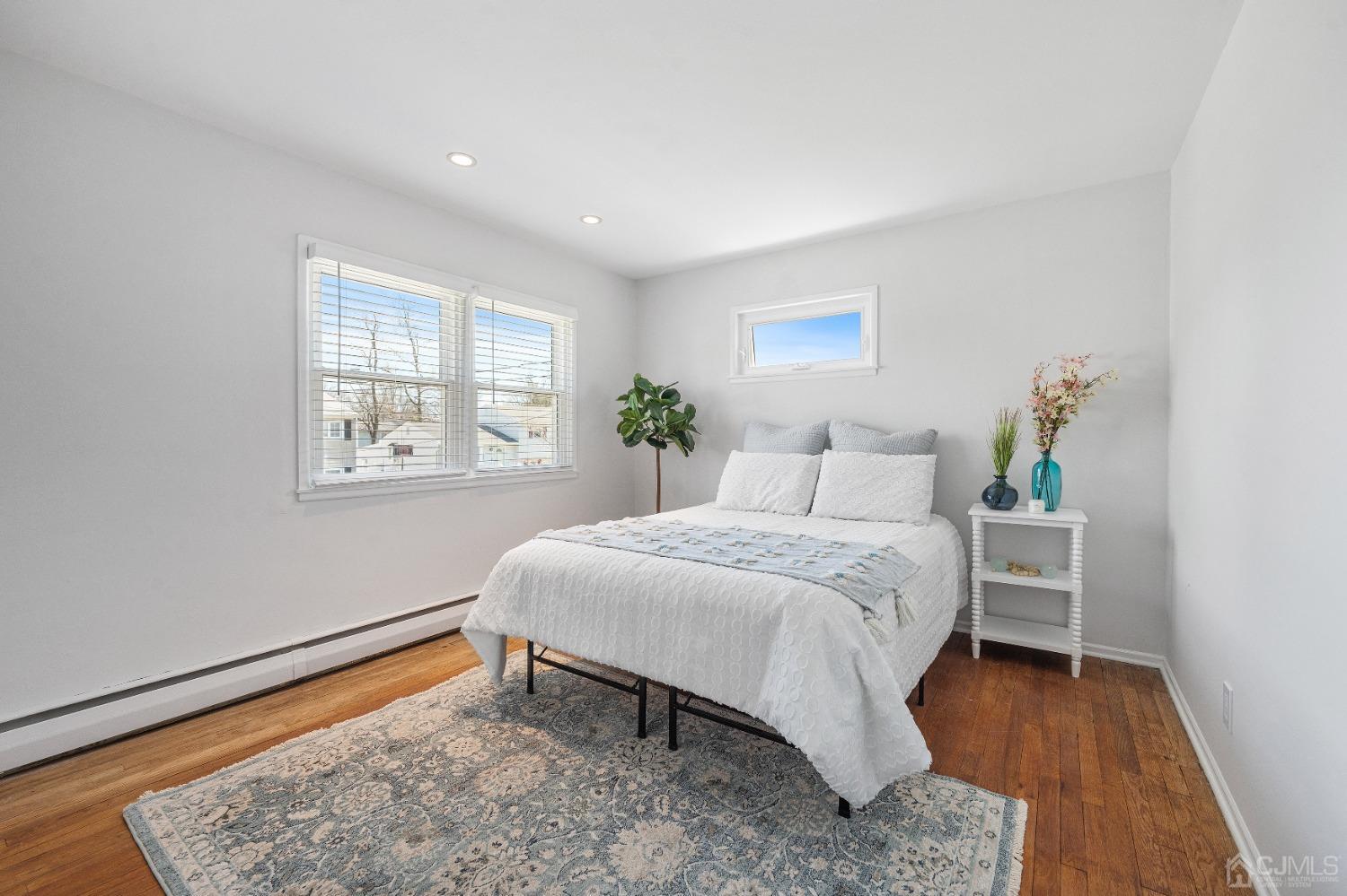 22 Baldwin Road Edison, NJ 08817 - Photo 8 of 30 a bed room with a bed and a window