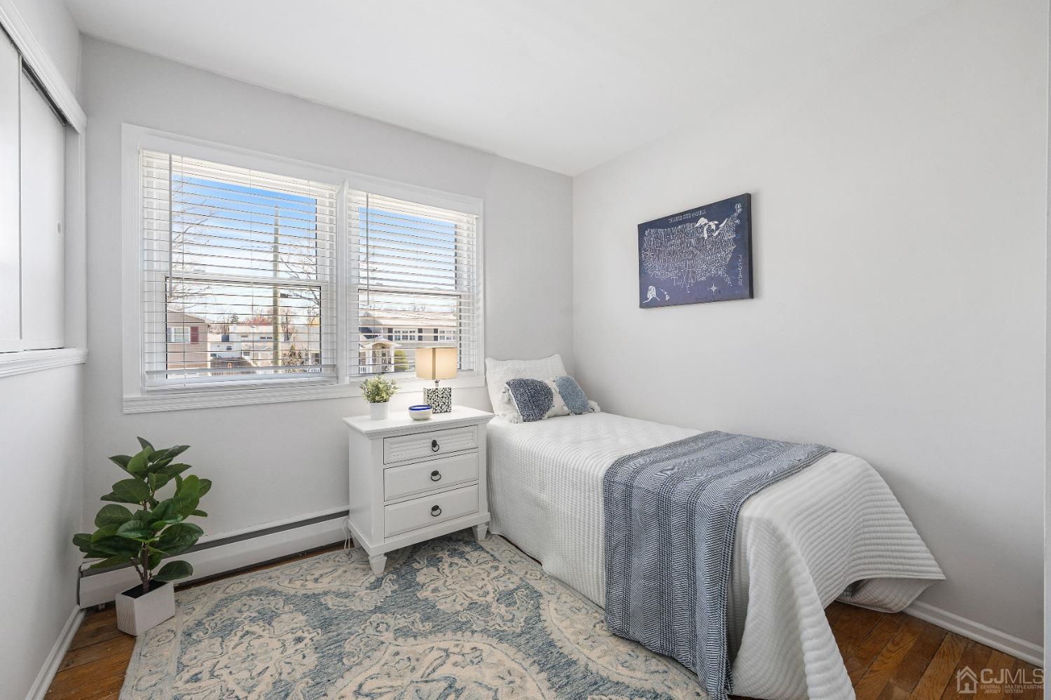 22 Baldwin Road Edison, NJ 08817 - Photo 9 of 30 a bedroom with a bed and a window