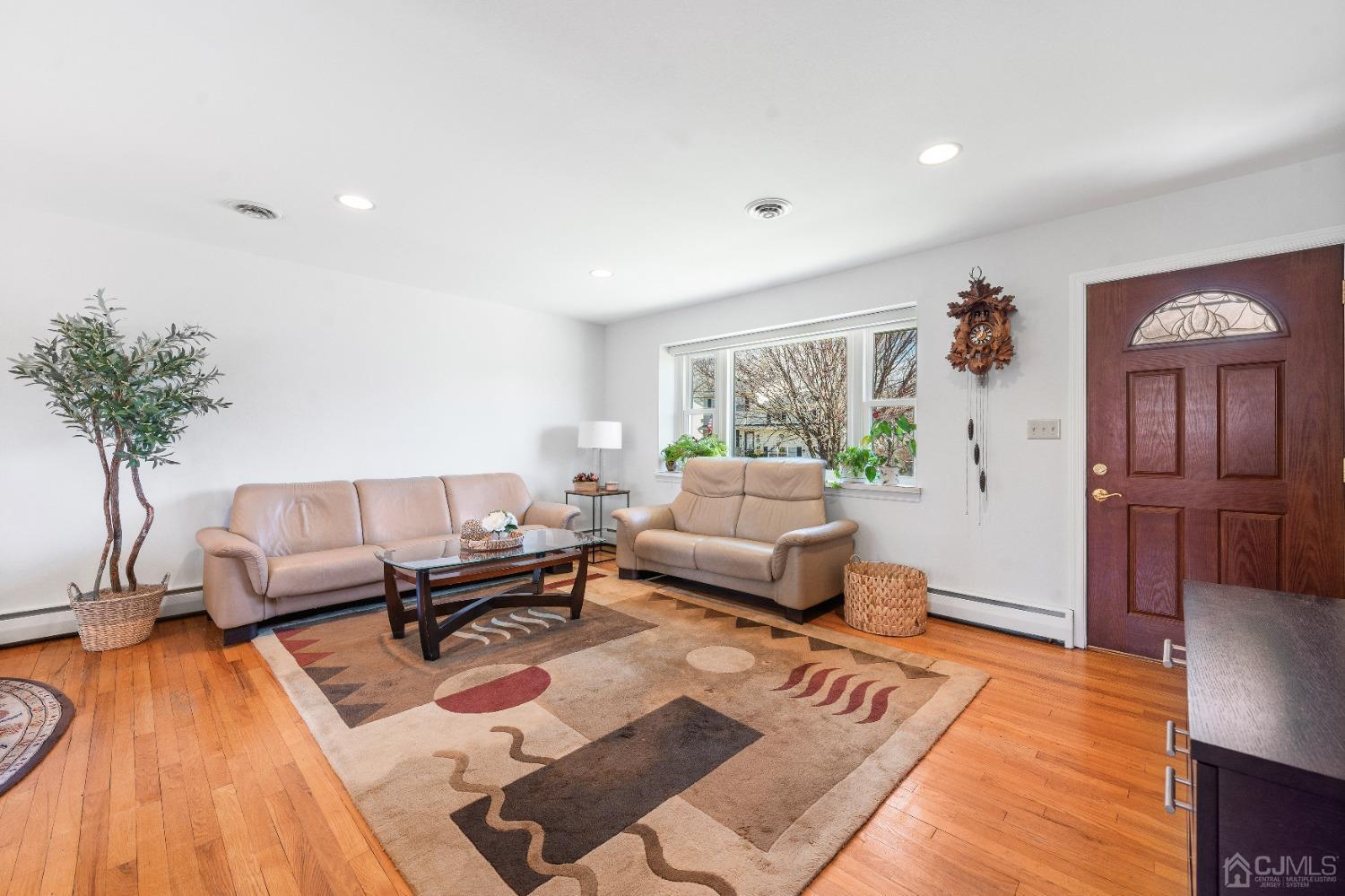22 Baldwin Road Edison, NJ 08817 - Photo 10 of 30 a living room with furniture and a wooden floor