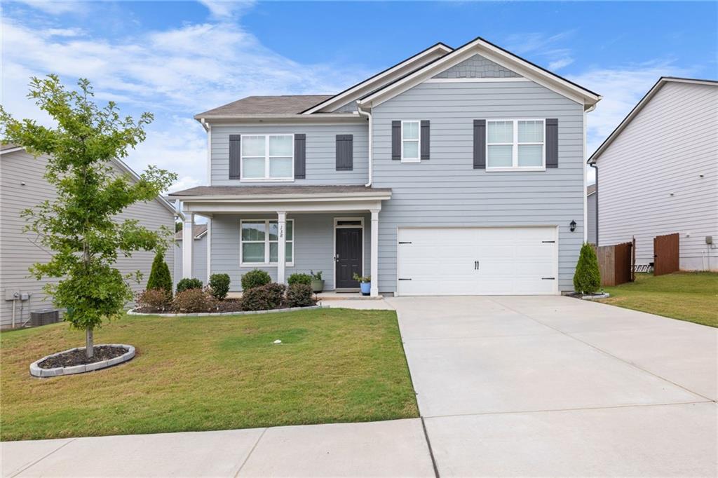 a front view of a house with a yard