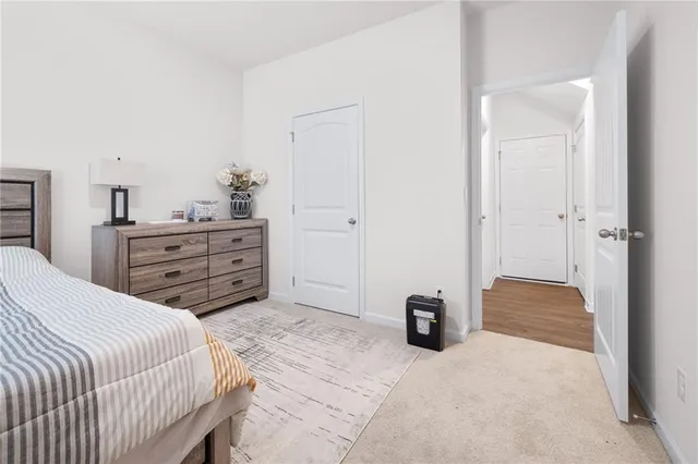 a bedroom with a bed and a cabinets