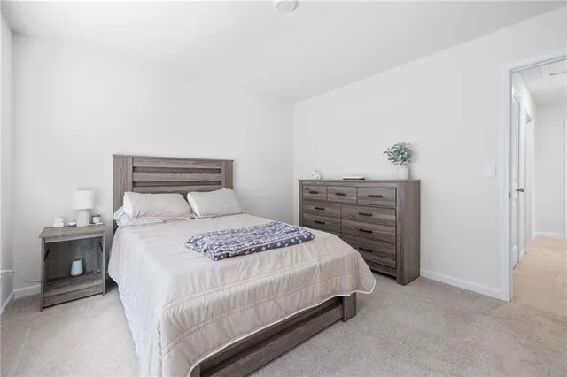 a bedroom with a bed and a dresser