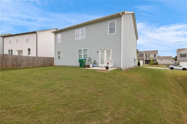 a front view of house with yard and seating