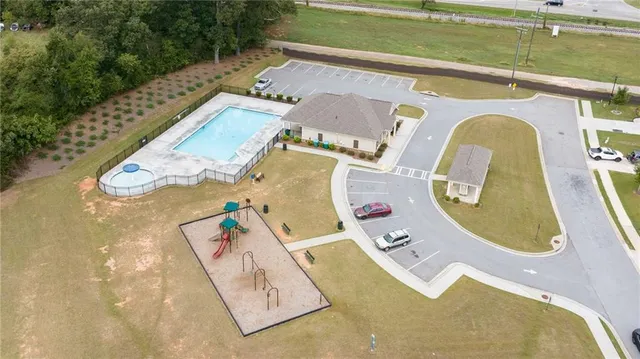 an aerial view of a house with swimming pool