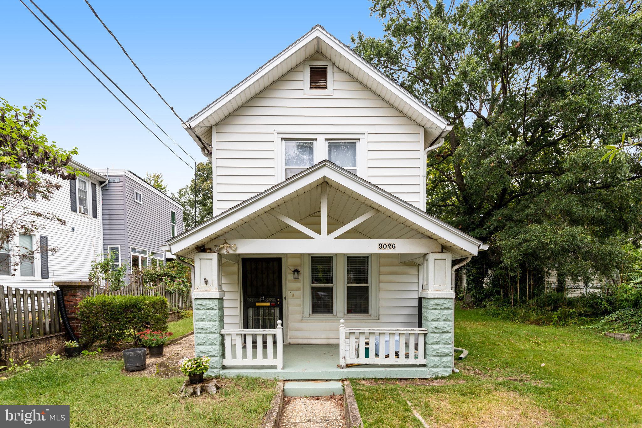 3026 Channing Street Northeast Washington, DC 20018 - Photo 1 of 24 a front view of a house with a yard