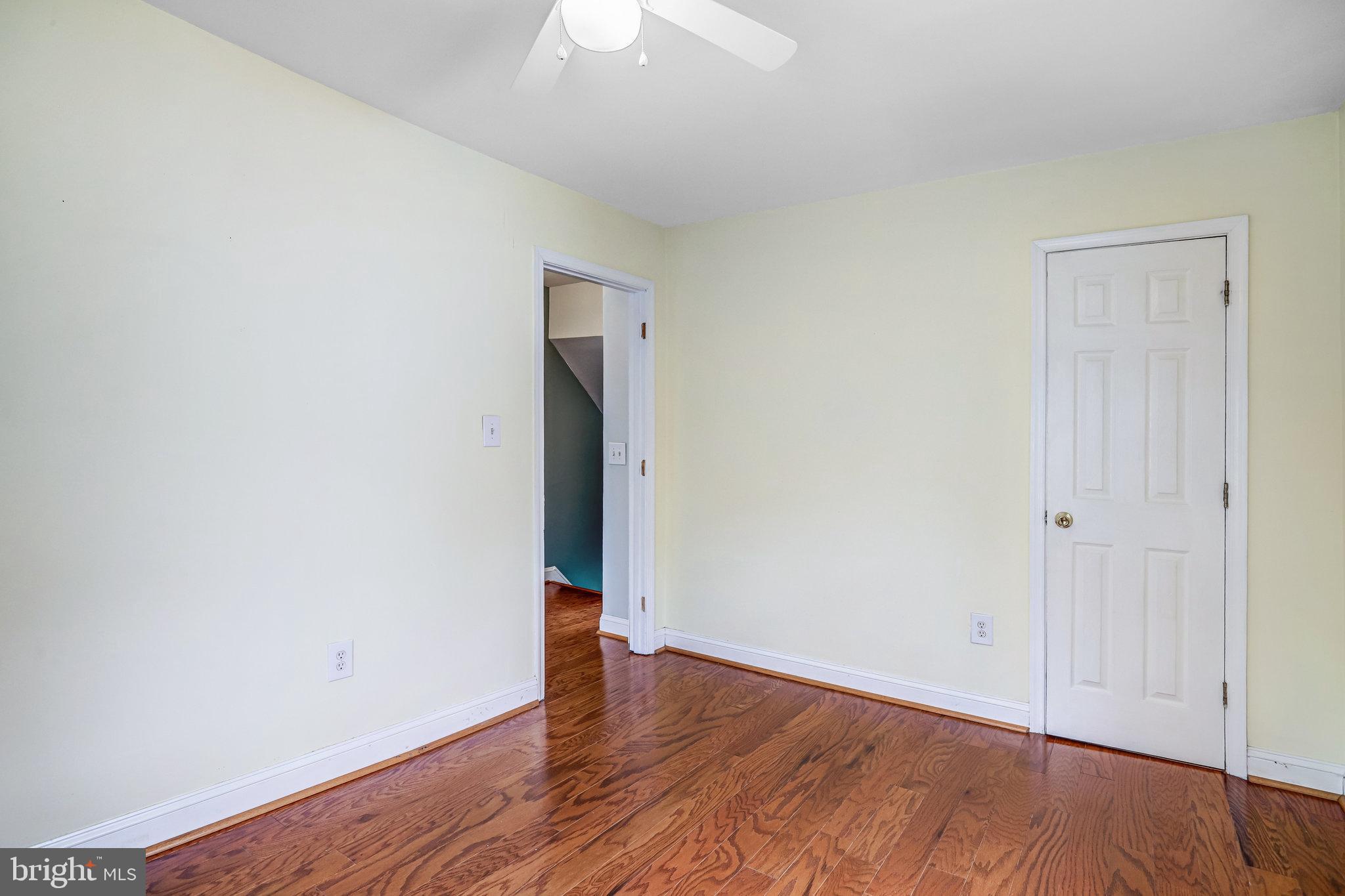 3026 Channing Street Northeast Washington, DC 20018 - Photo 13 of 24 an empty room with wooden floor