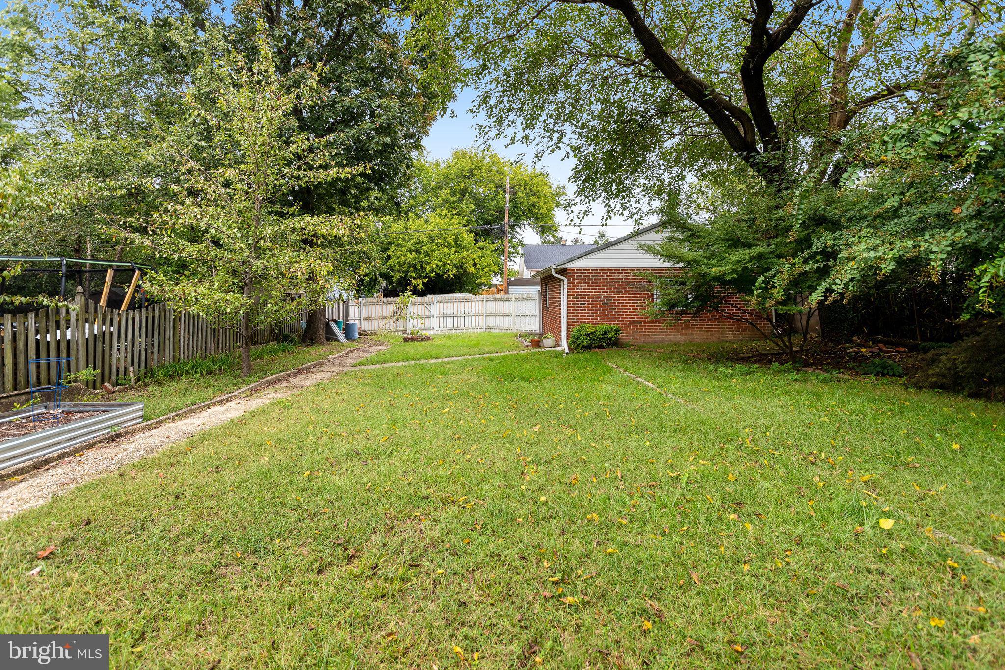 3026 Channing Street Northeast Washington, DC 20018 - Photo 17 of 24 a view of a house with a yard and sitting area