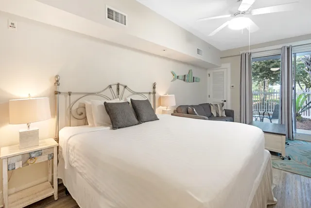 a bedroom with bed and window