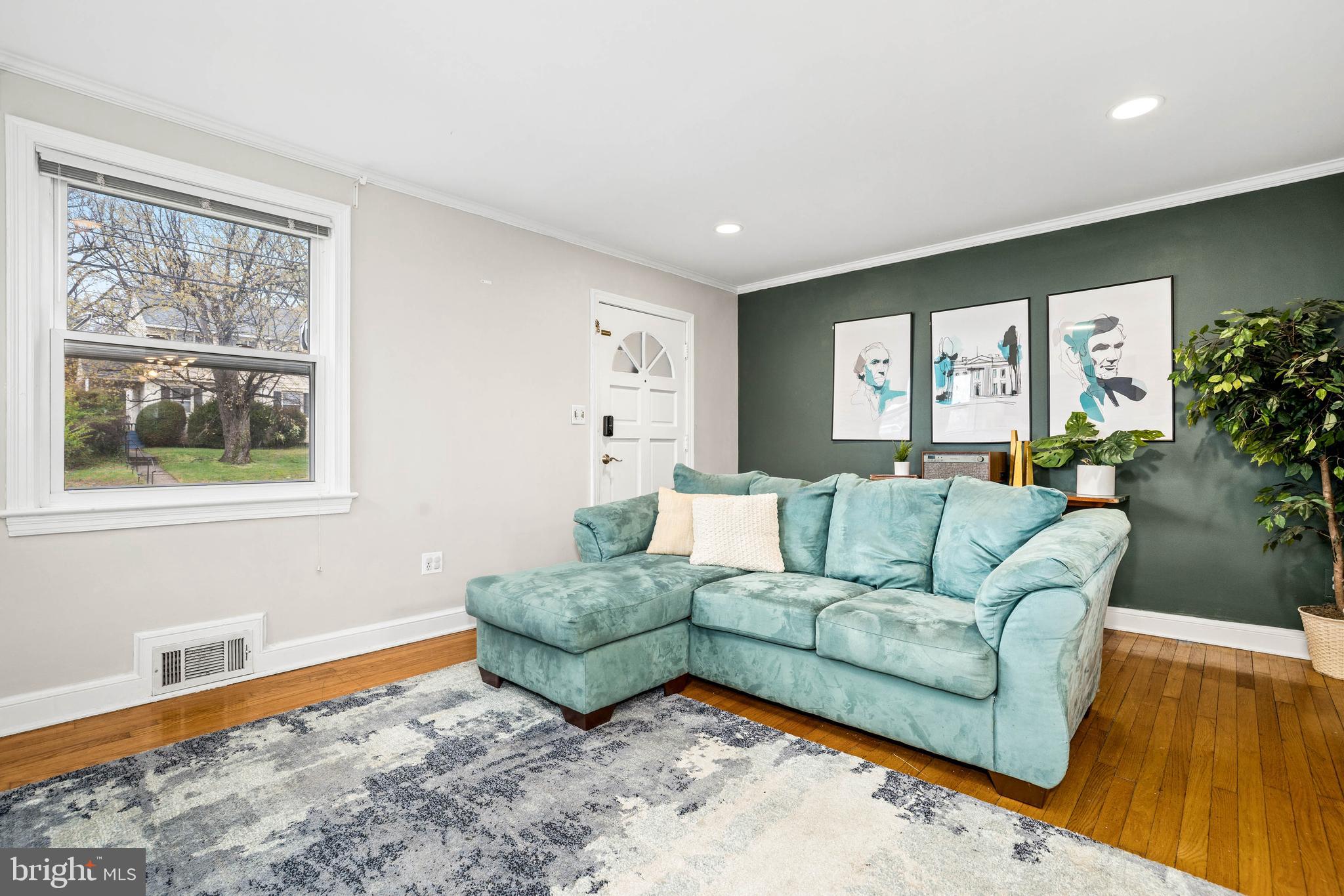 10149 Sutherland Road Silver Spring, MD 20901 - Photo 13 of 31 a living room with furniture and a large window