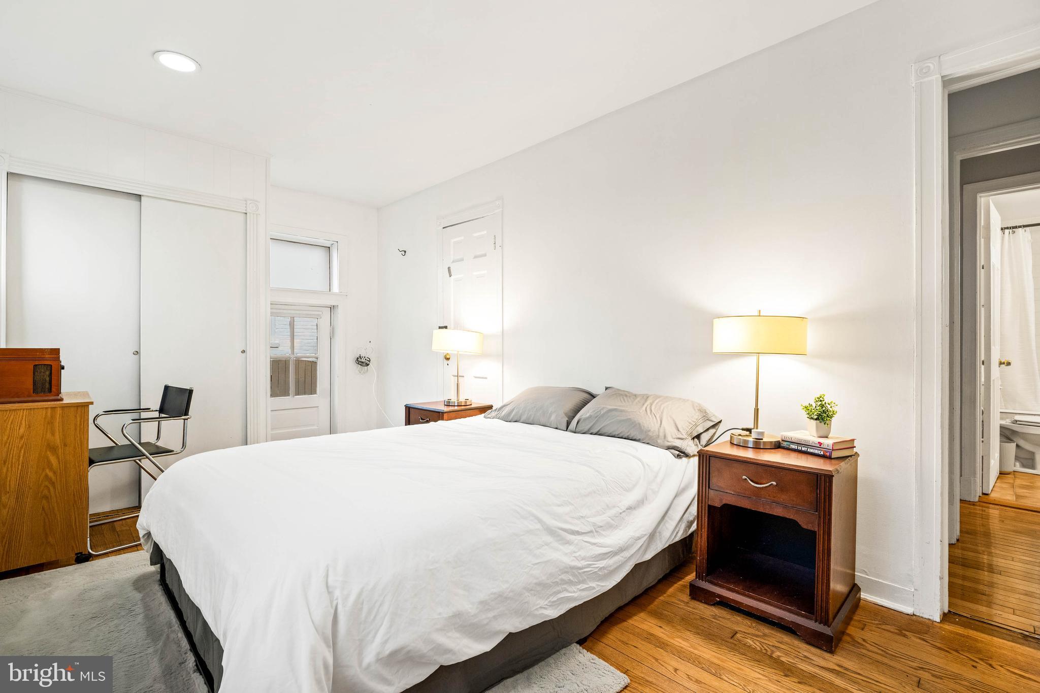 10149 Sutherland Road Silver Spring, MD 20901 - Photo 24 of 31 a bedroom with a bed and a lamp