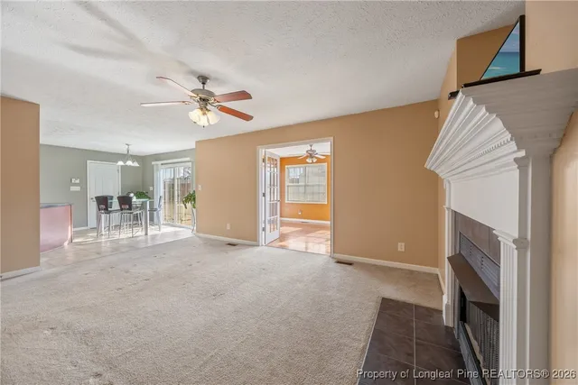 a view of livingroom with furniture and a fireplace
