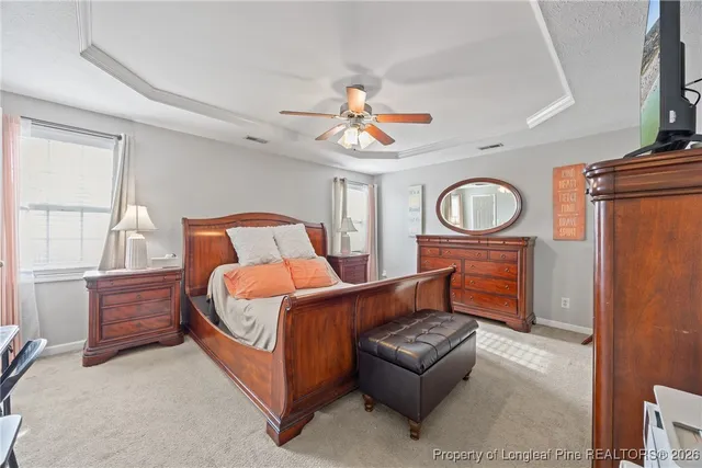 a bedroom with bed and window