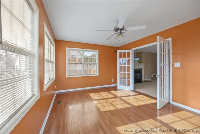 an outdoor sitting area with furniture and city view