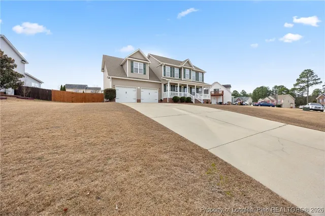 a view of a house with a street