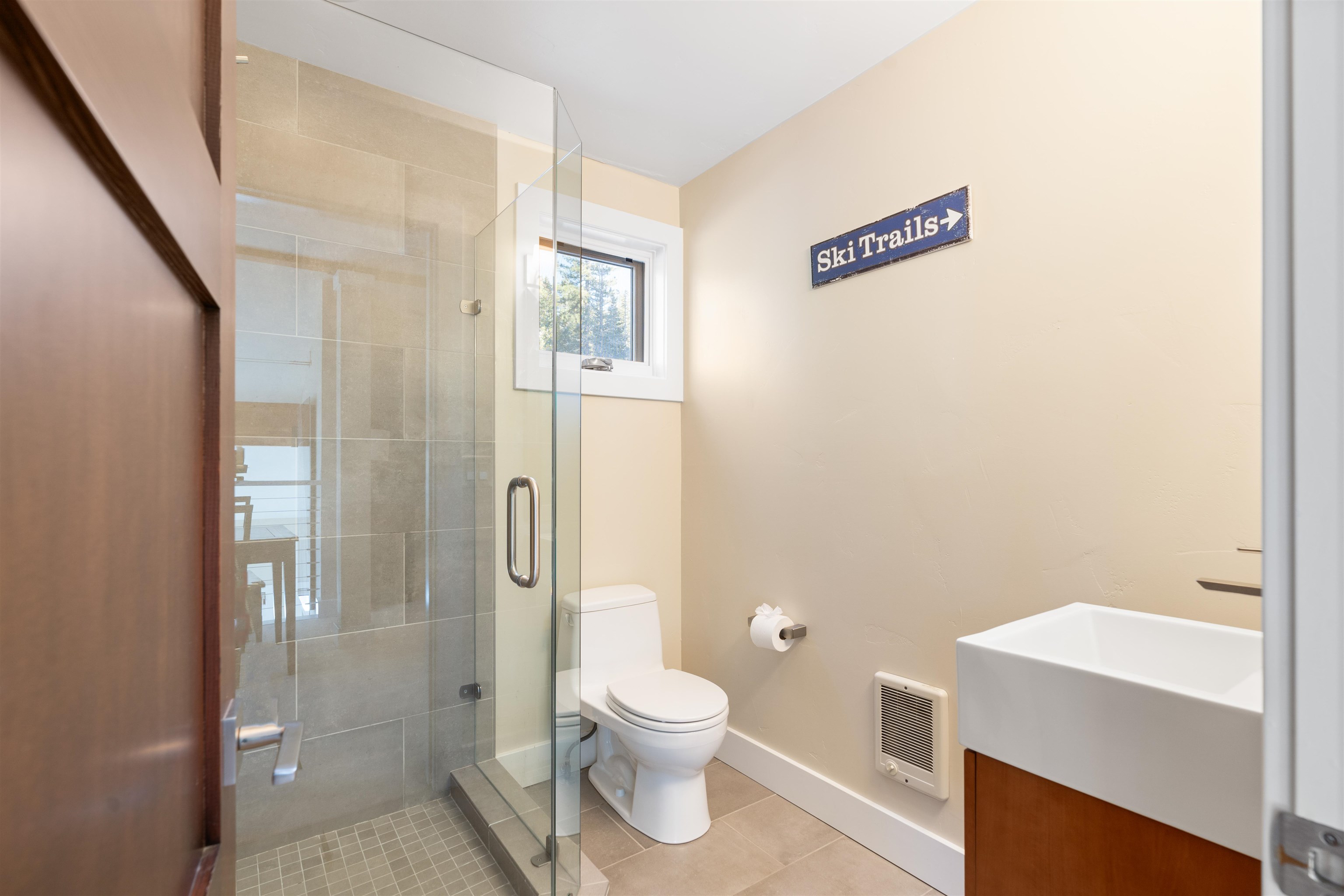 3003 Meadow Court, Unit 1 Olympic Valley, CA 96146 - Photo 19 of 24 a bathroom with a granite countertop toilet a sink and a mirror