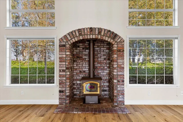 a kitchen with a sink cabinets and wooden floor