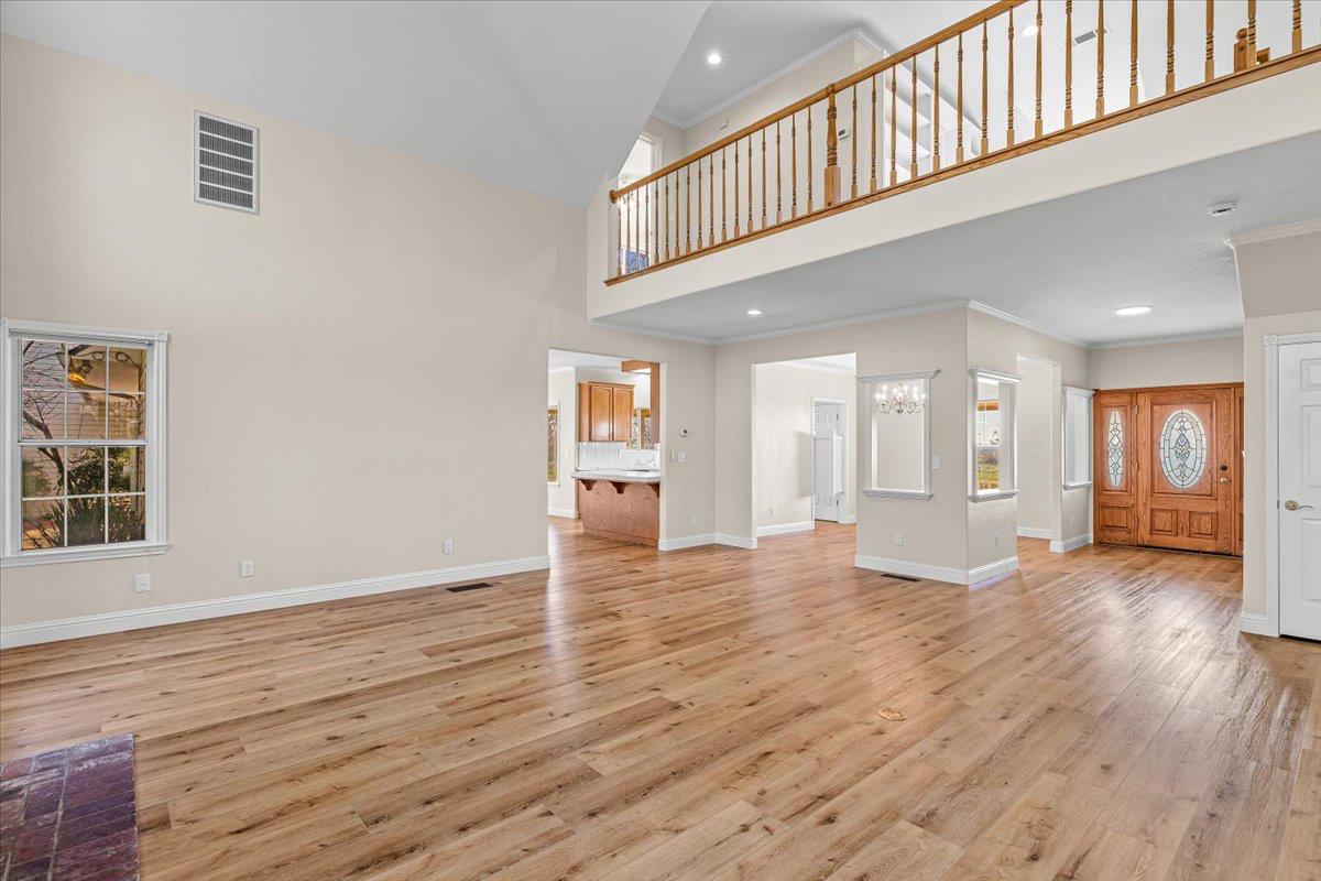 12900 Angrave Road Herald, CA 95638 - Photo 17 of 99 a view of an empty room with wooden floor and a window