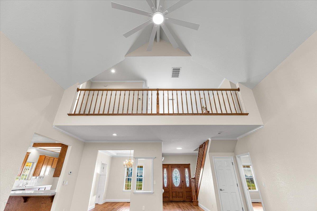 12900 Angrave Road Herald, CA 95638 - Photo 18 of 99 a view of an entryway wooden floor and a chandelier fan