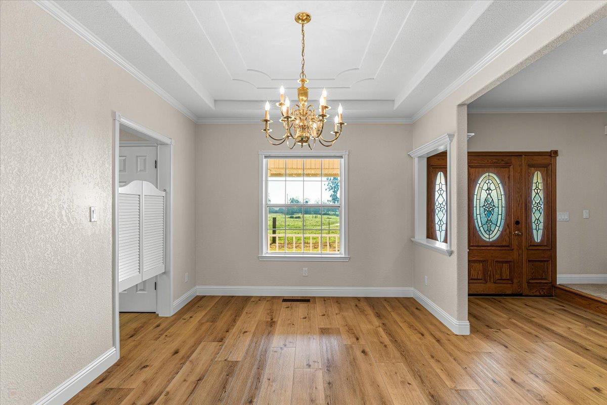12900 Angrave Road Herald, CA 95638 - Photo 19 of 99 a view of an empty room window and wooden floor