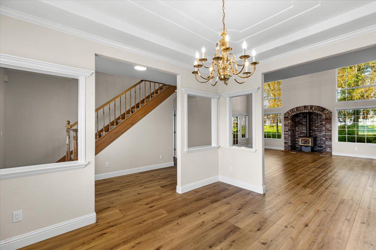 12900 Angrave Road Herald, CA 95638 - Photo 20 of 99 a view of an entryway with wooden floor and a chandelier