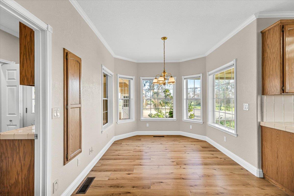 12900 Angrave Road Herald, CA 95638 - Photo 27 of 99 a view of empty room with wooden floor and fan