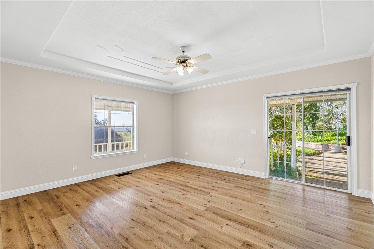 12900 Angrave Road Herald, CA 95638 - Photo 35 of 99 a view of an empty room with a window and wooden floor