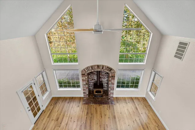 a view of an empty room with a fan