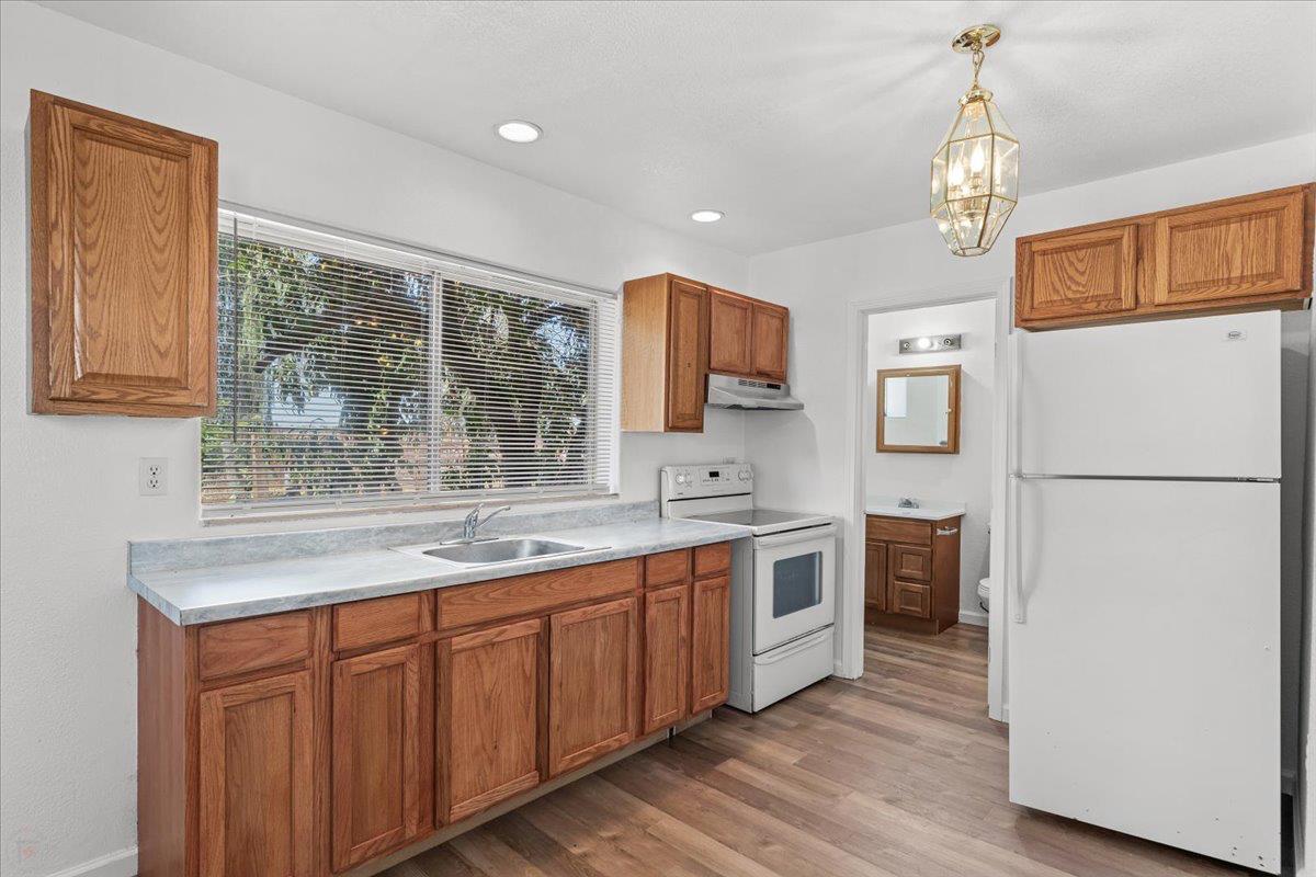 12900 Angrave Road Herald, CA 95638 - Photo 75 of 99 a kitchen with a sink stainless steel appliances and cabinets
