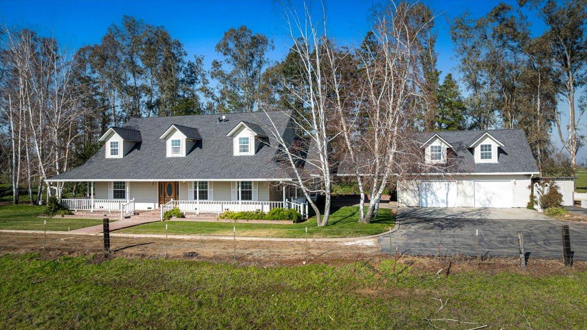 12900 Angrave Road Herald, CA 95638 - Photo 9 of 99 a front view of a house with a yard and trees