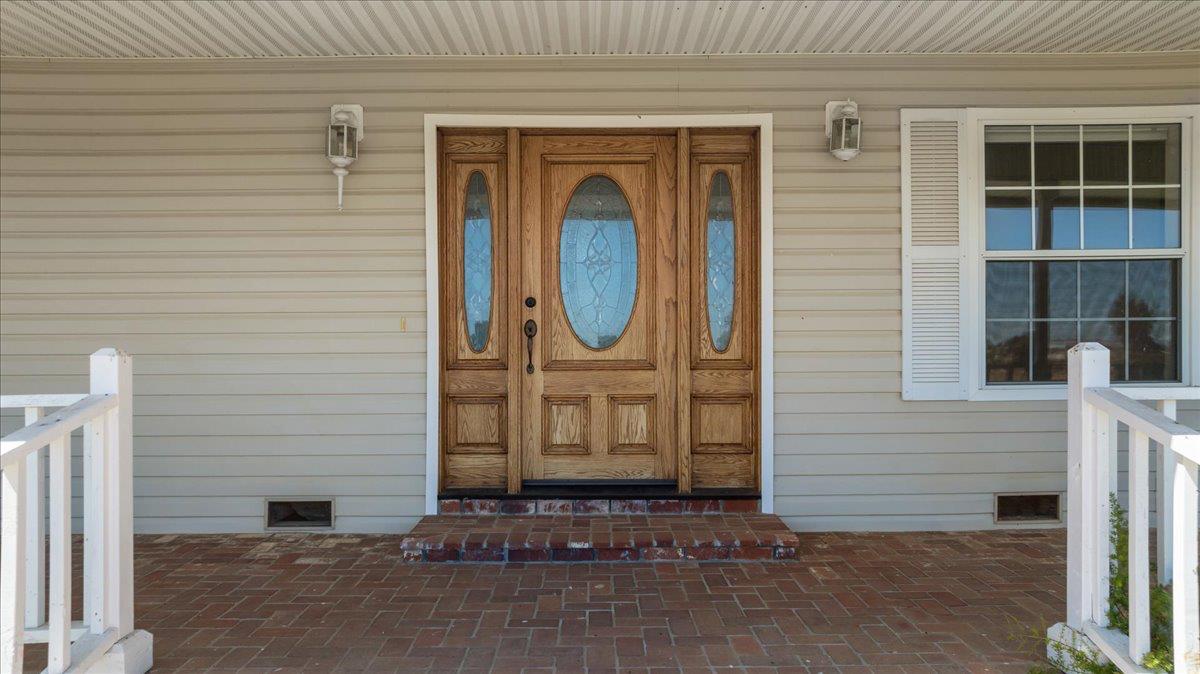 12900 Angrave Road Herald, CA 95638 - Photo 10 of 99 a front view of a house with a gate