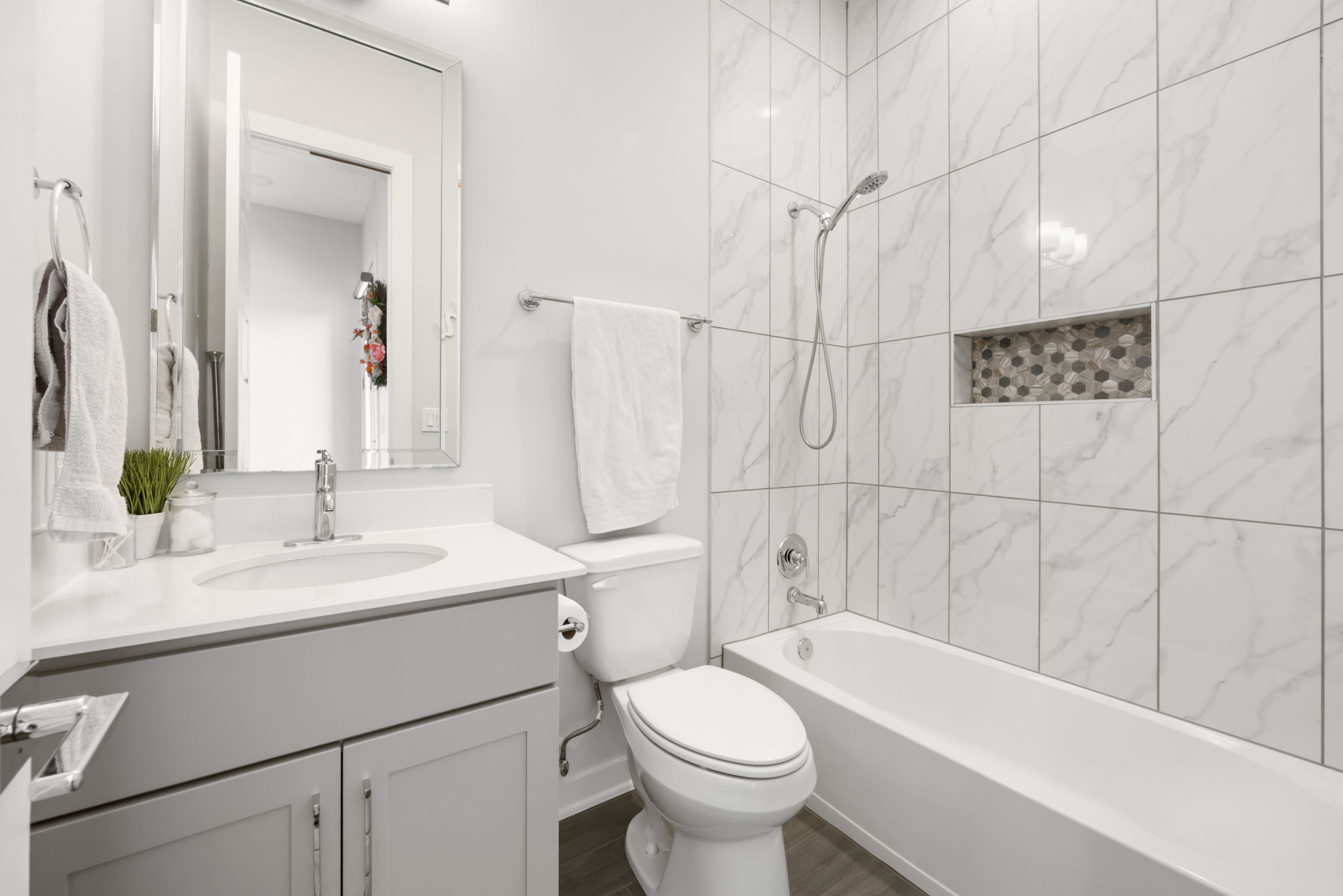 1417 Kramer Lane, Unit 14 Austin, TX 78758 - Photo 15 of 33 2nd floor Full bath featuring shower combination, vanity, and dark wood-type flooring