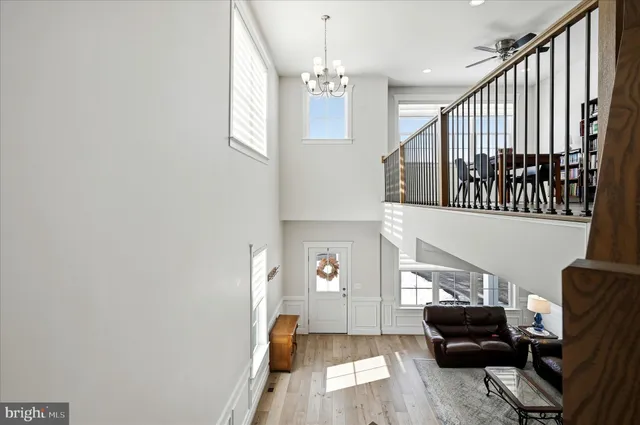 a spacious bathroom with a shower sink and mirror
