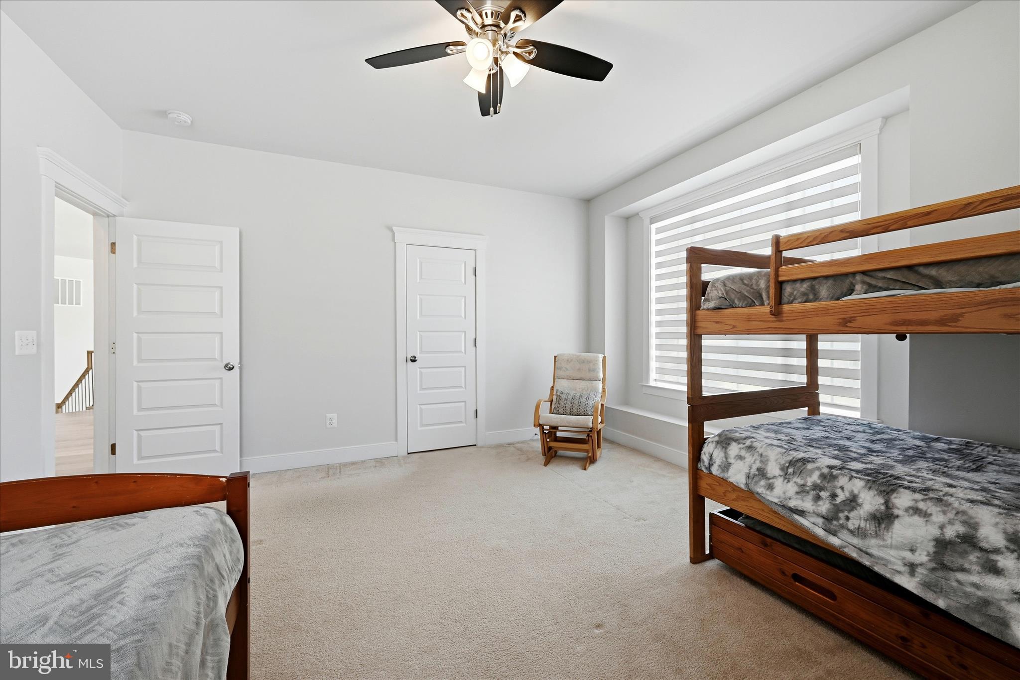 35939 Fieldside Way Round Hill, VA 20141 - Photo 38 of 82 a bedroom with a bed and a chandelier