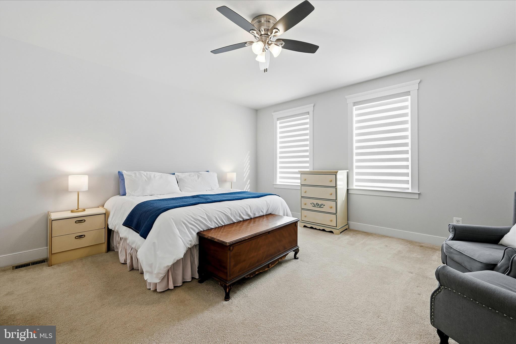 35939 Fieldside Way Round Hill, VA 20141 - Photo 47 of 82 a spacious bedroom with a bed and a couch