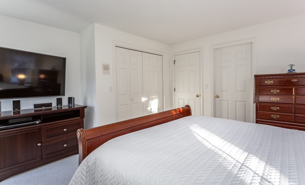 20 Sandy Way Mashpee, MA 02649 - Photo 17 of 33 a bedroom with a bed and a flat screen tv