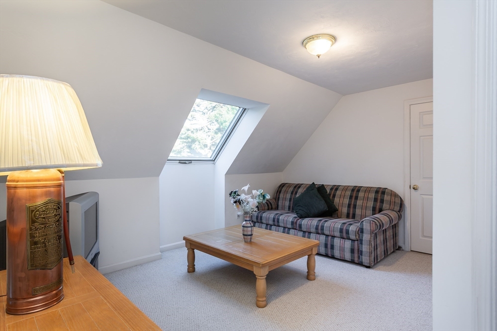 20 Sandy Way Mashpee, MA 02649 - Photo 18 of 33 a living room with furniture and a fireplace