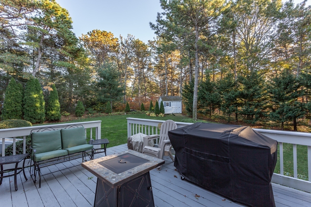 20 Sandy Way Mashpee, MA 02649 - Photo 29 of 33 a view of a deck with furniture and a backyard