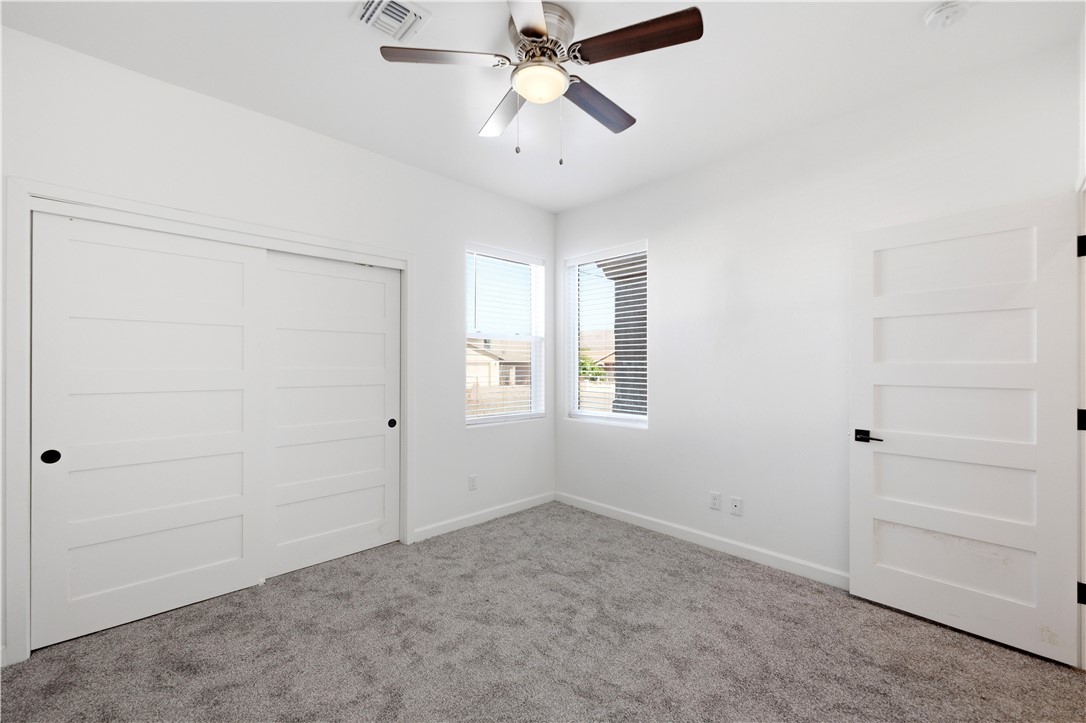 3546 North Skylark Road Kingman, AZ 86409 - Photo 15 of 30 wooden floor in an empty room with a window