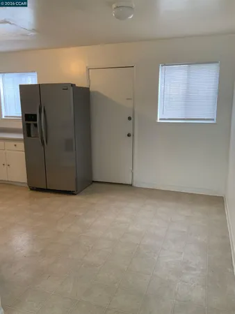 a view of a refrigerator in a kitchen