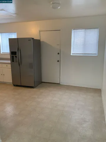 a view of a refrigerator in a kitchen