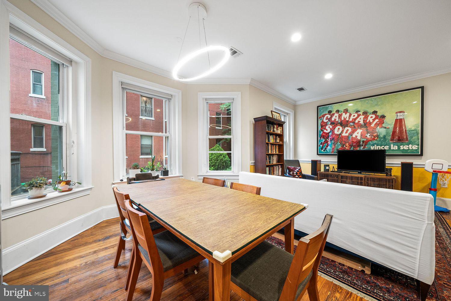 1423 R Street Northwest, Unit 105 Washington, DC 20009 - Photo 10 of 32 a view of a dining room with furniture window and outside view