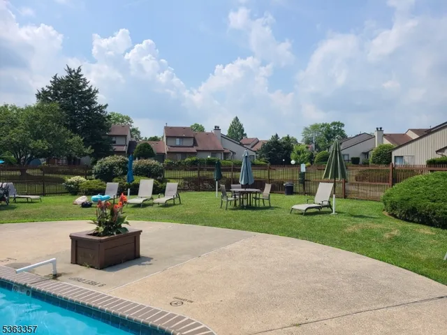 a view of a park with houses in back
