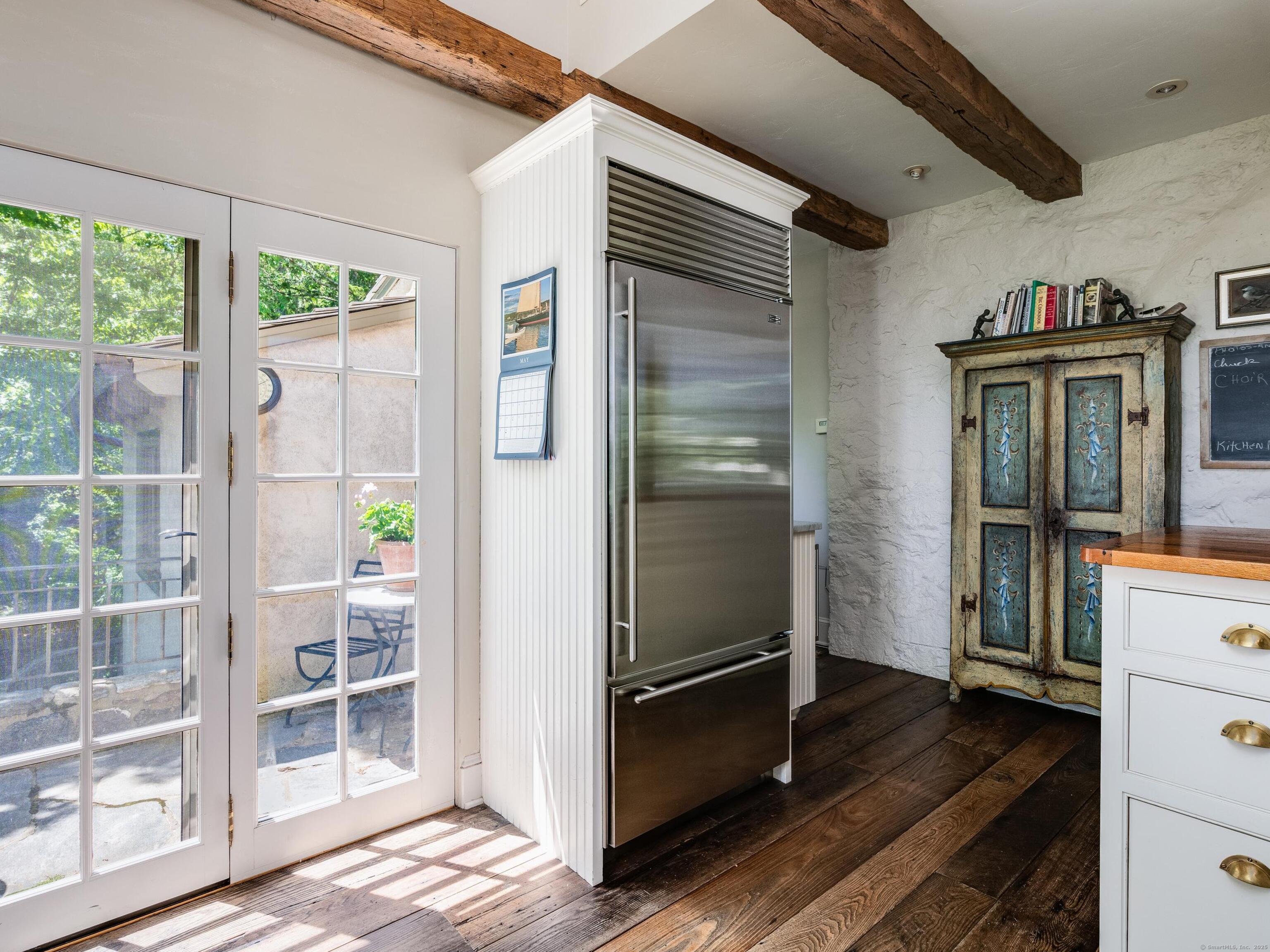 213 Beaver Brook Road Lyme, CT 06371 - Photo 13 of 38 a kitchen with kitchen island a counter top space and stainless steel appliances